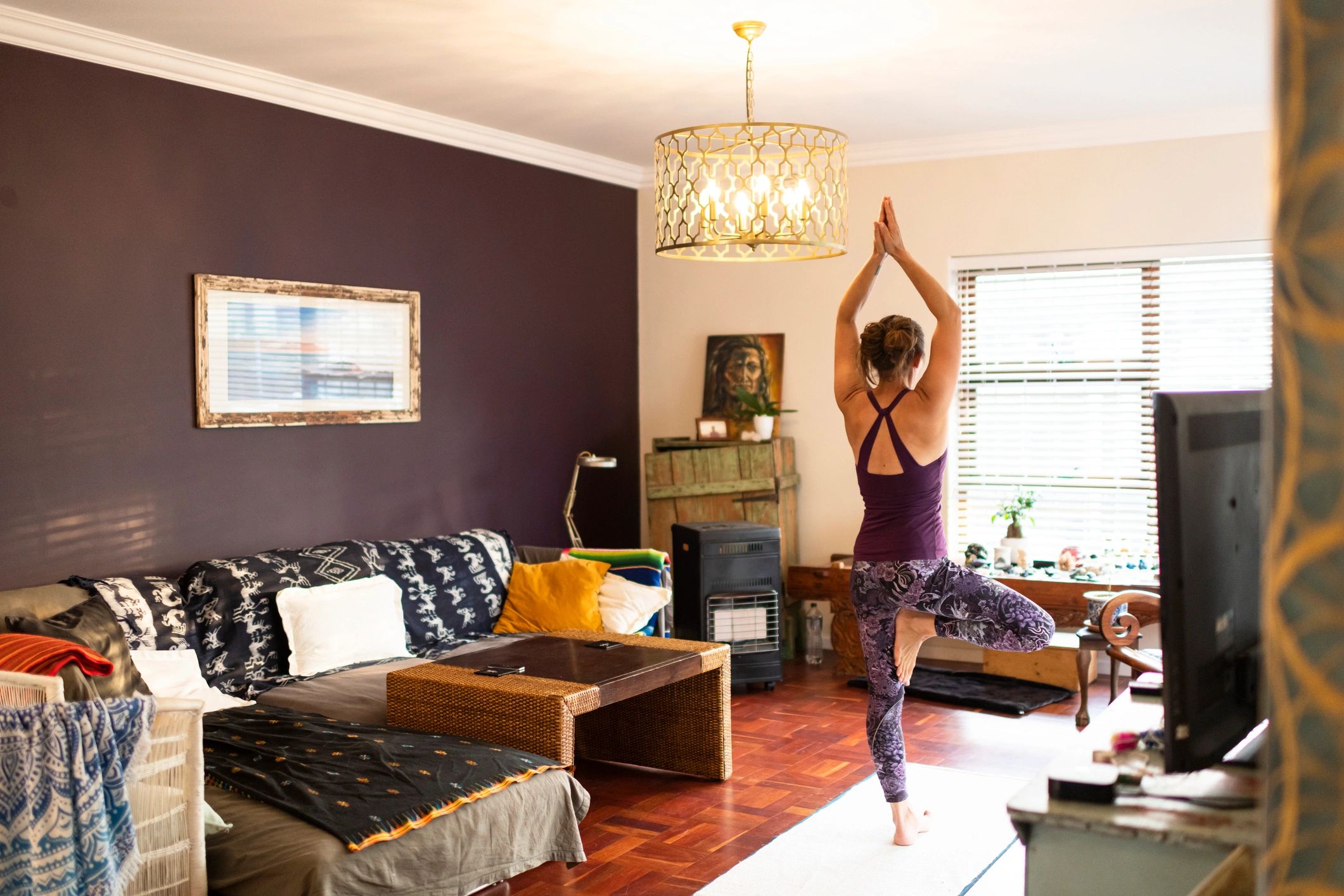 Woman practicing yoga at home in a calm setting